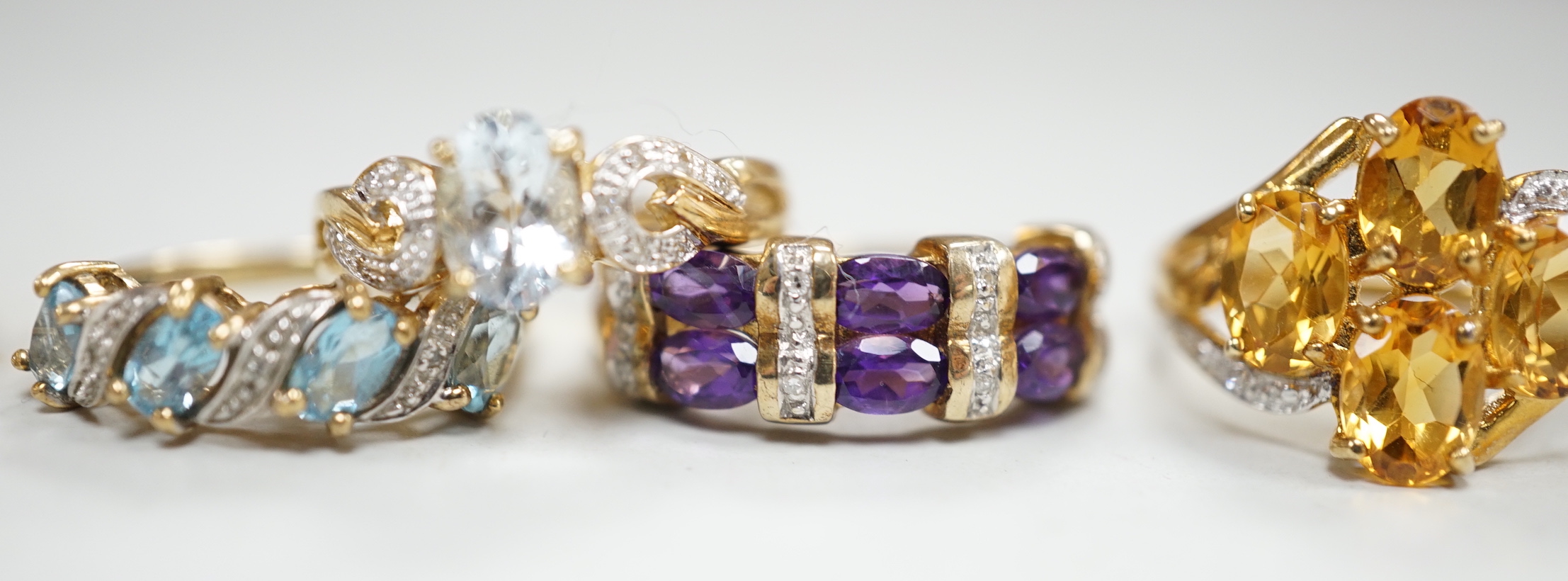 Five assorted modern 9ct gold and gem set dress rings, including citrine and diamond and amethyst and diamond, gross weight 14.8 grams.